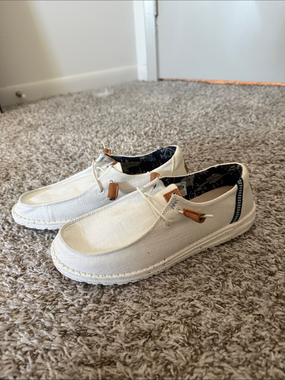 Women’s white Hey Dude slip-on loafers